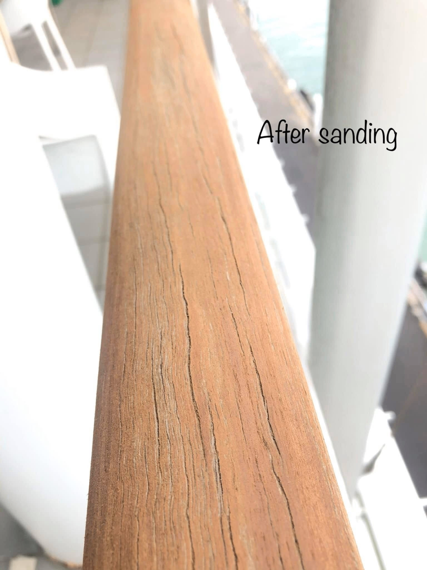 Close-up of timber handrail after sanding and preparation