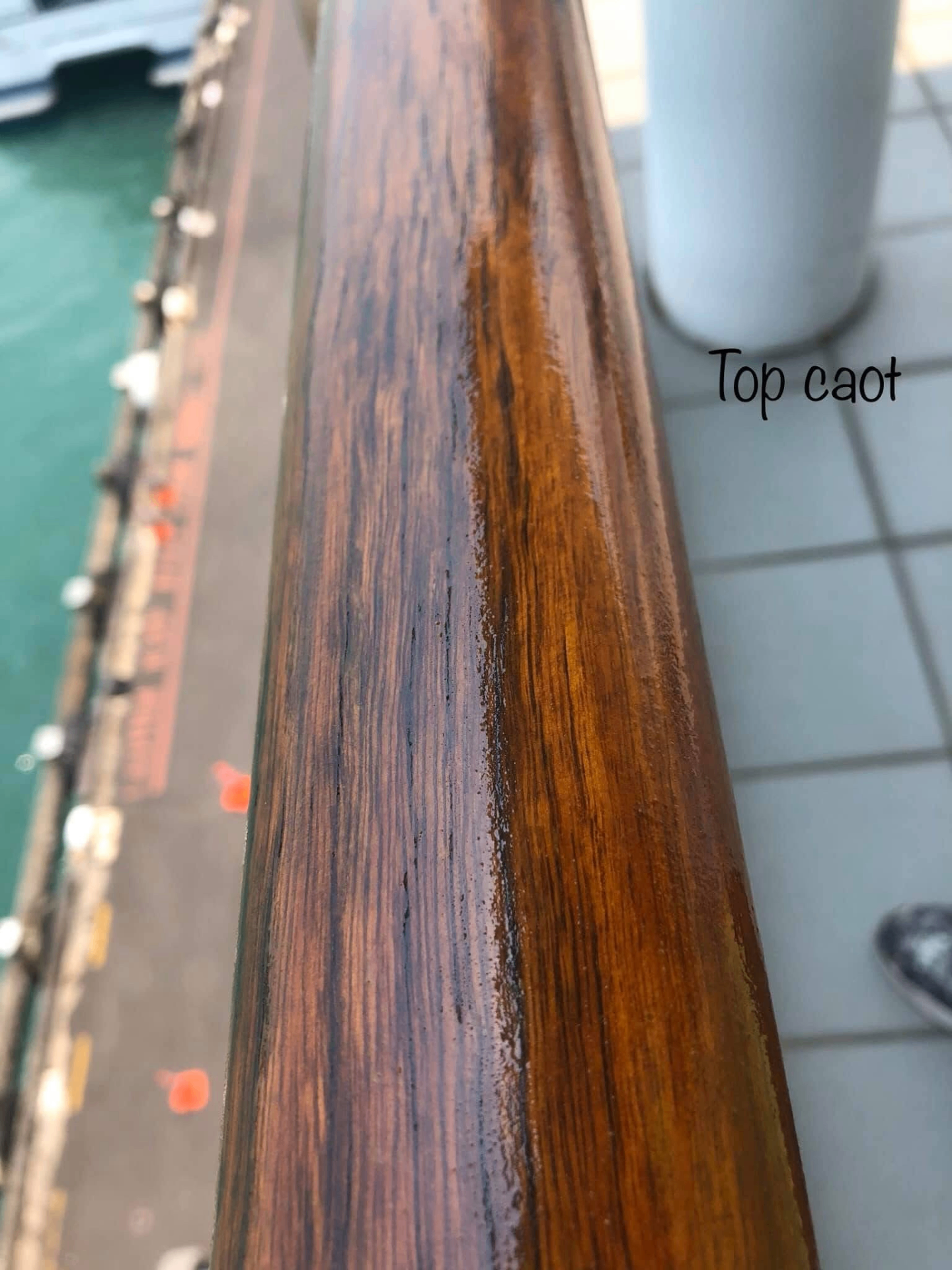 Close-up of timber handrail with restored gloss top coat finish